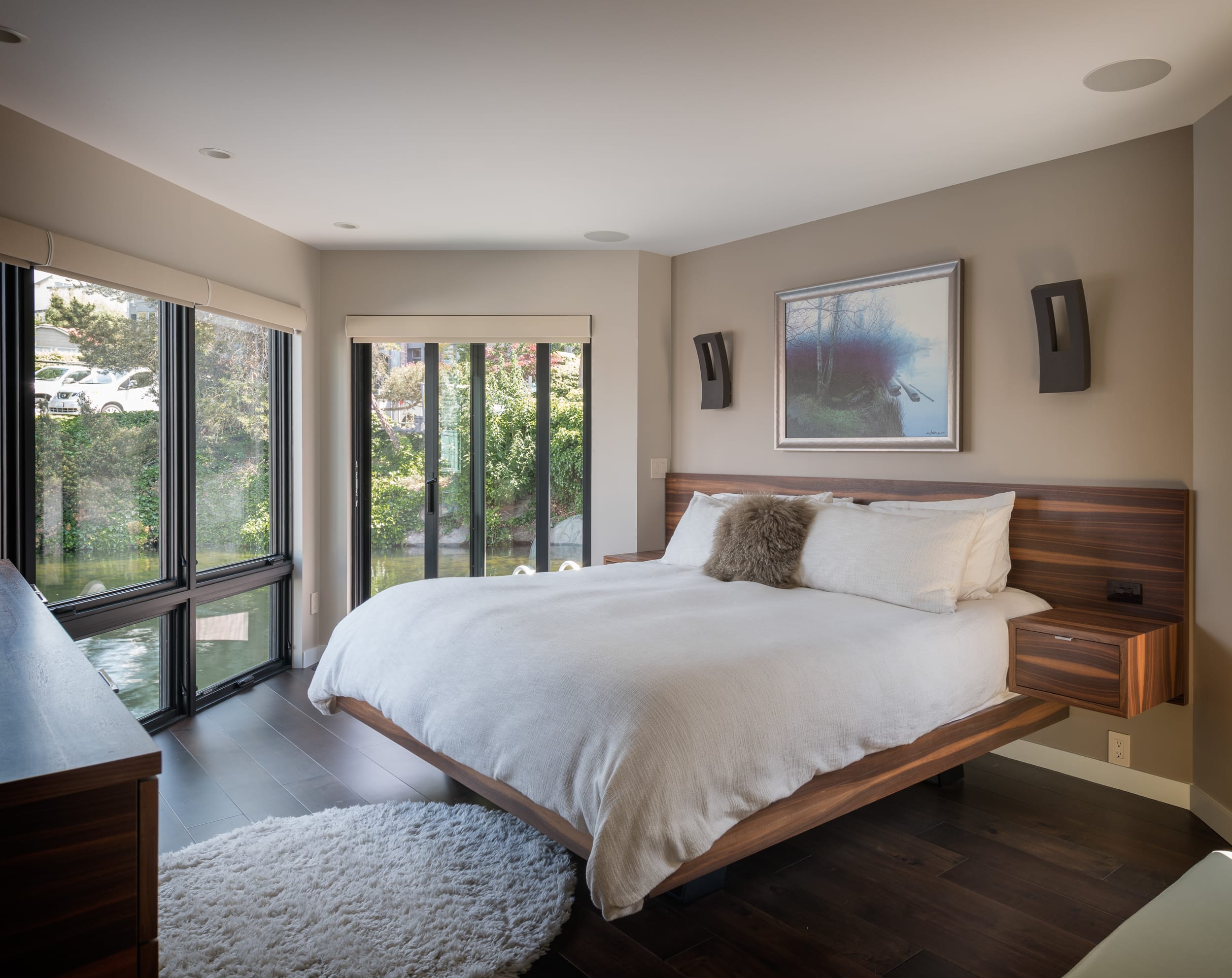 A modern bed in a bedroom of a home building.