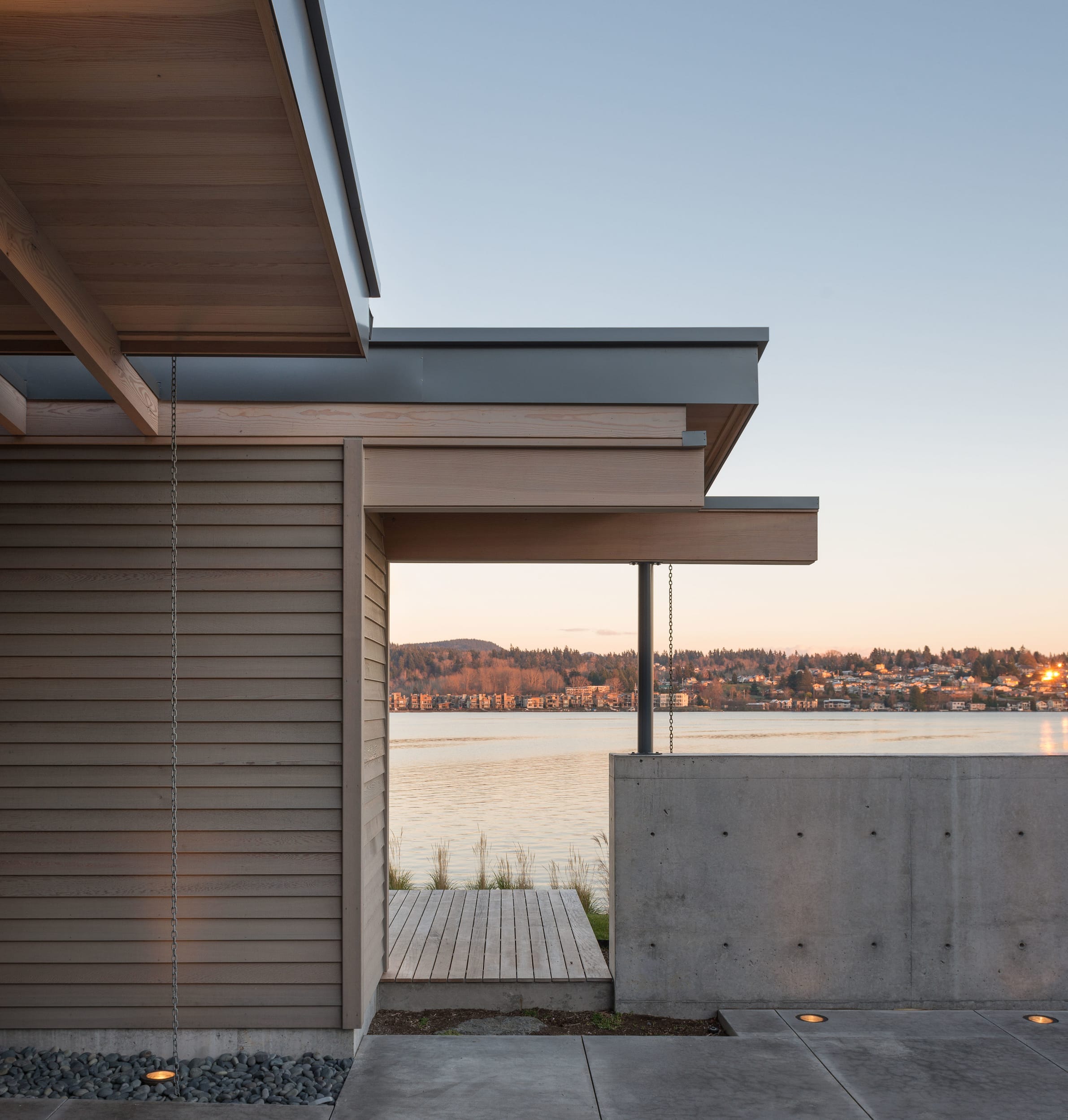 A modern house with a view of the water.