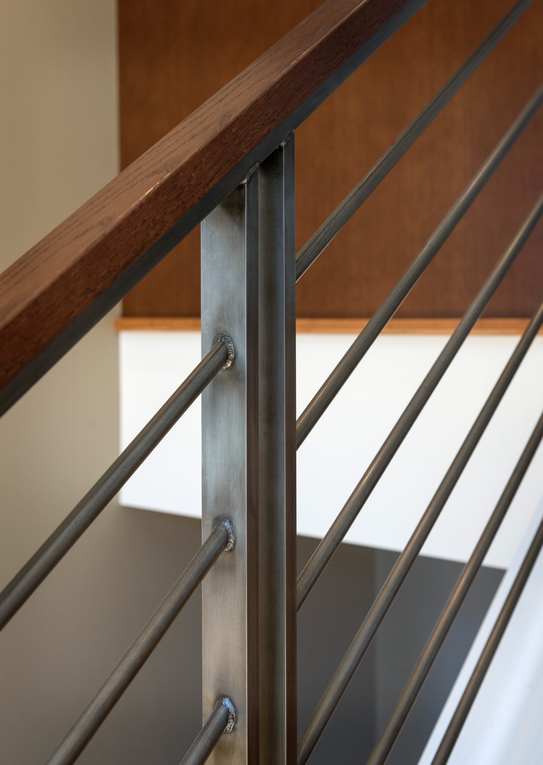 A close up of a metal railing in a home.