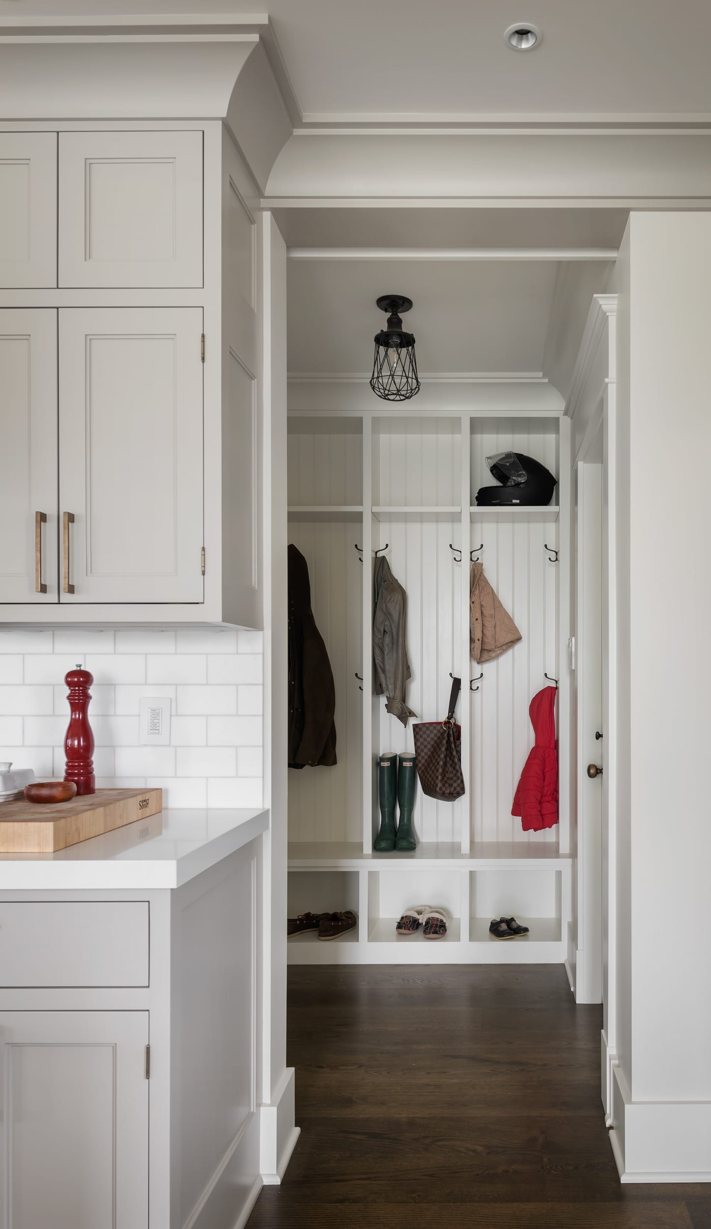 A modern home with white cabinets and a mudroom.