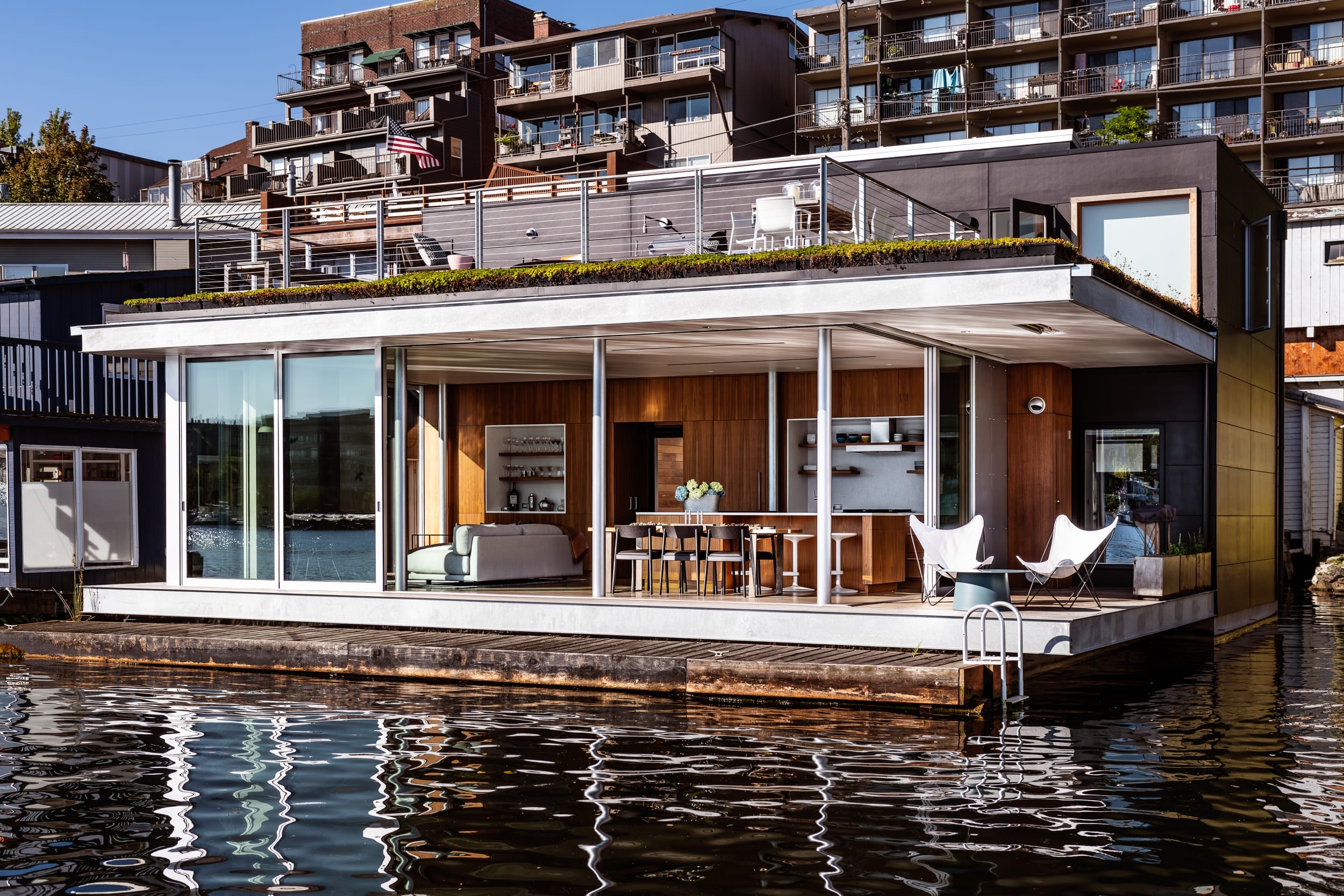 A houseboat on the water in a city.