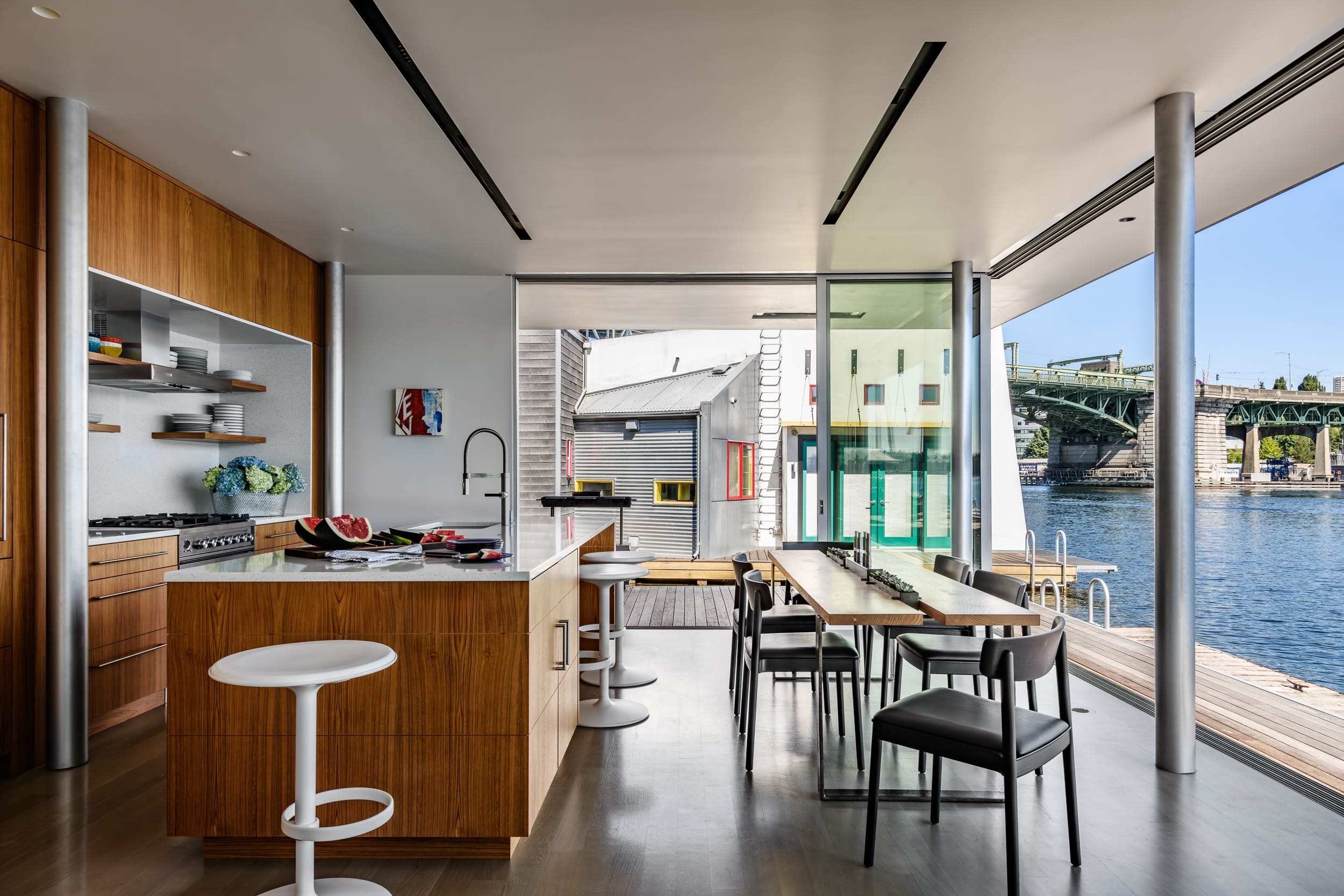 A modern kitchen with a view of the water.