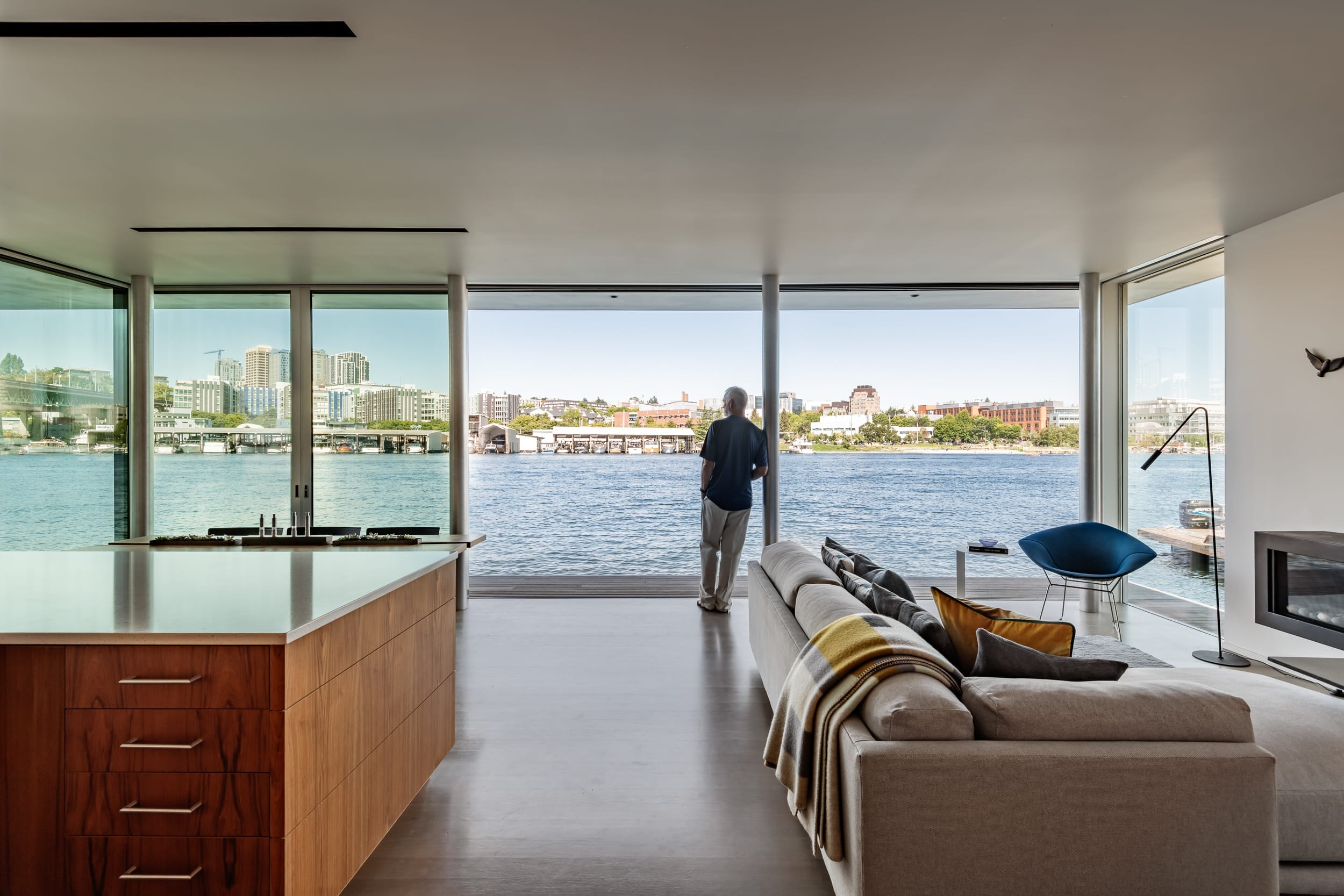 A living room with a view of the water.
