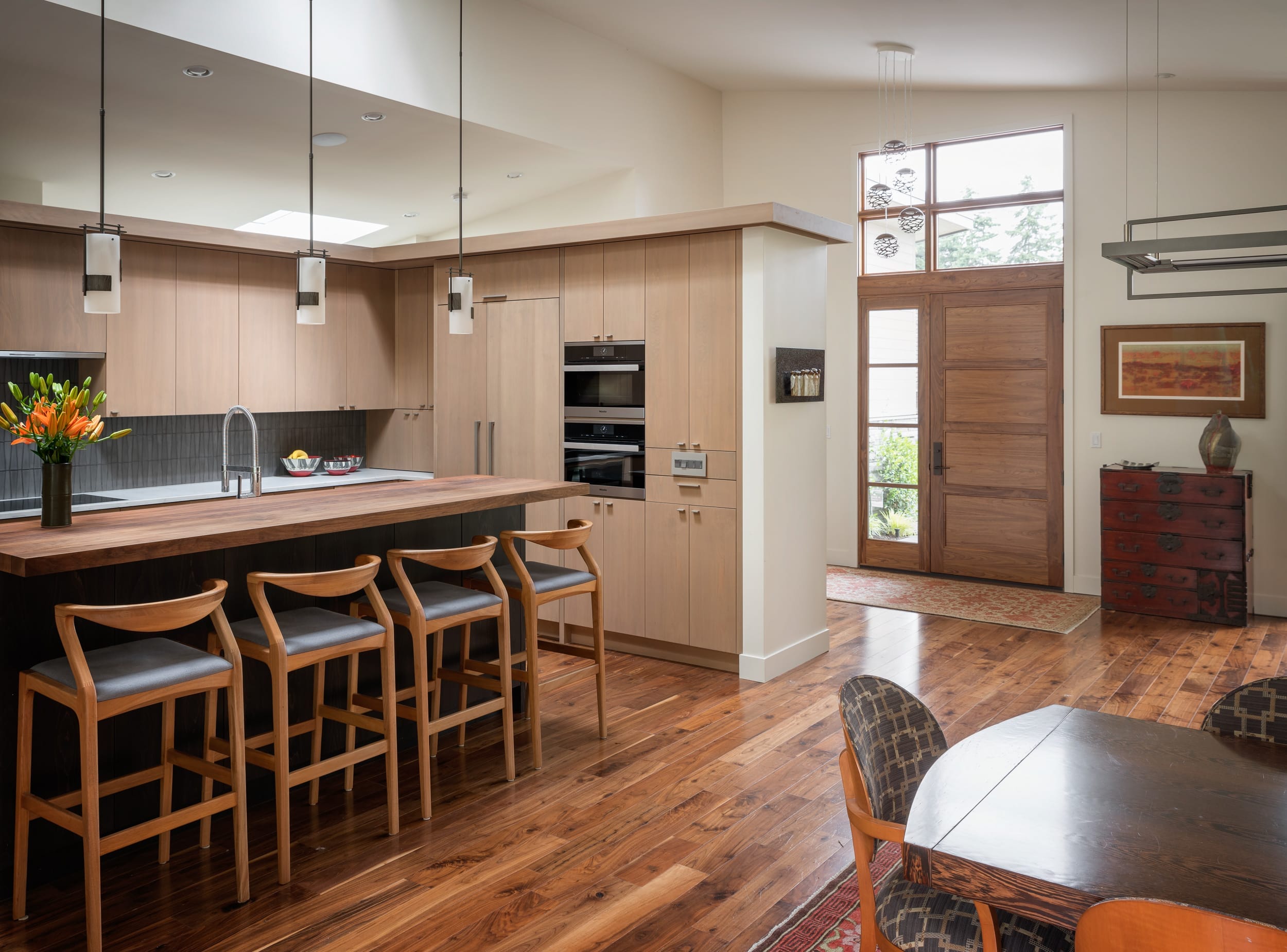 A modern kitchen with wooden floors.
