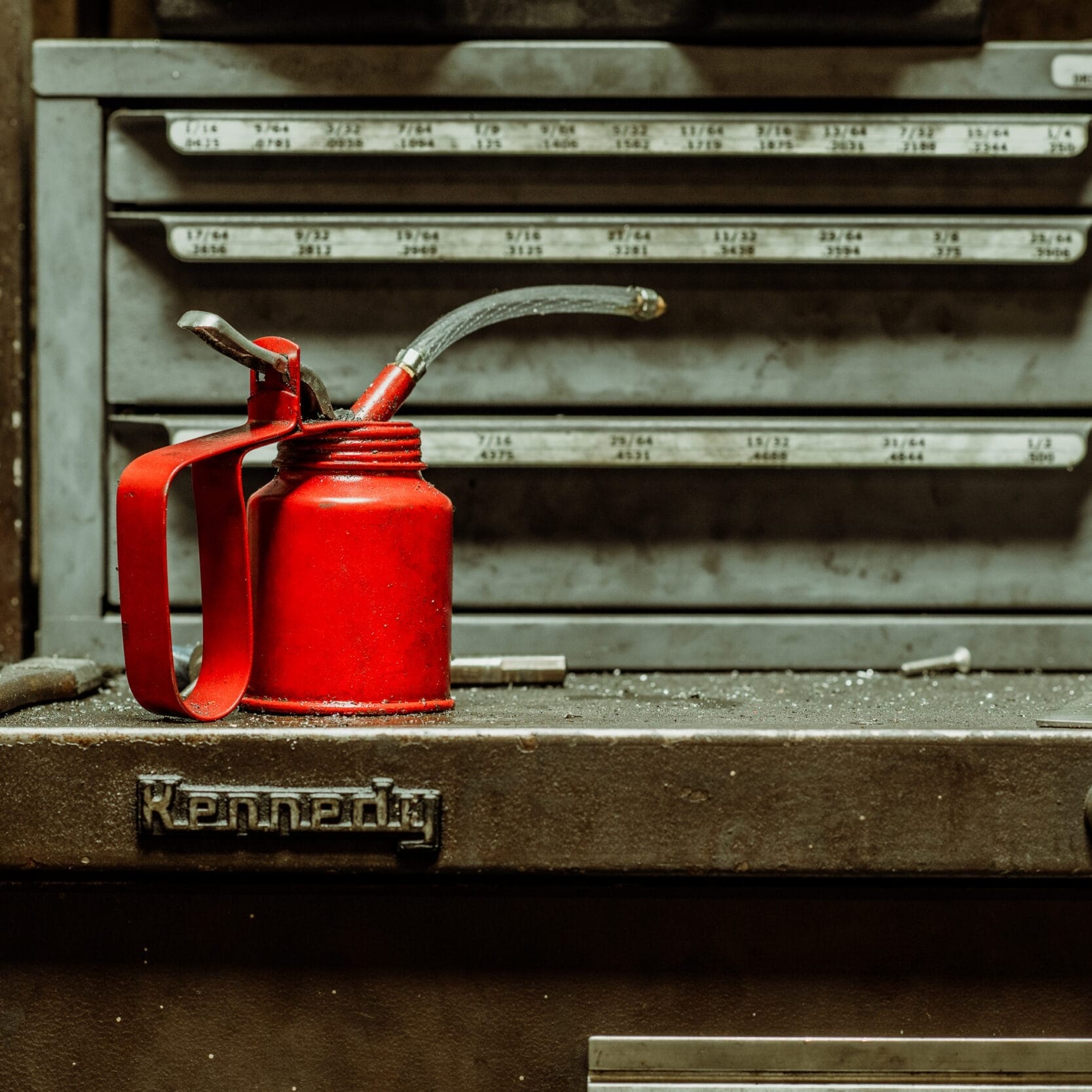 A red can sitting on top of a toolbox at Dyna Metal Shop Seattle.