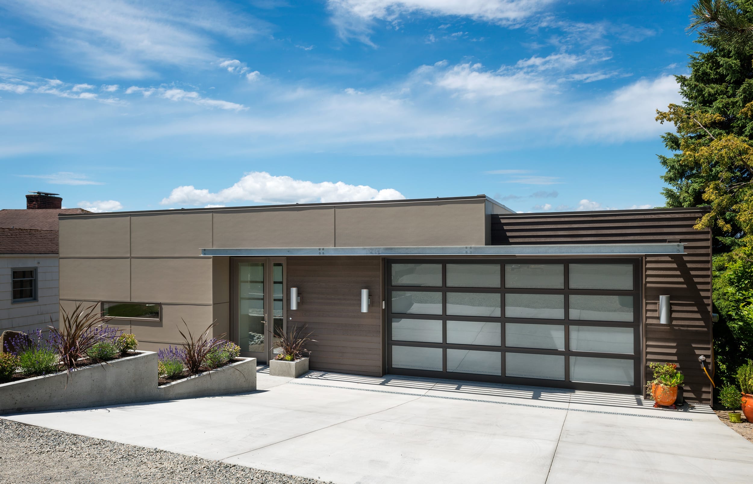A modern home with a garage and driveway.