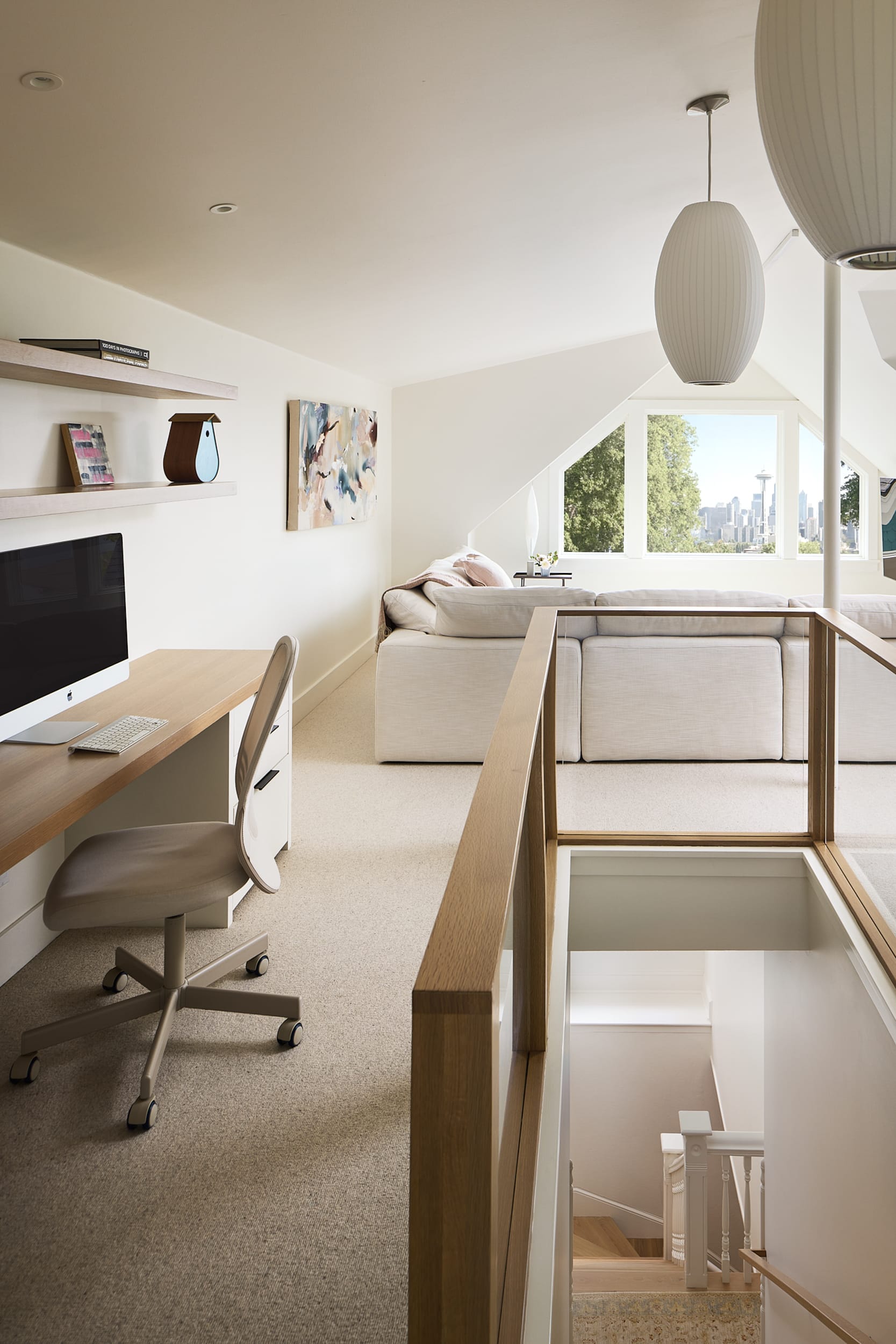 A modern home with a desk and a chair.