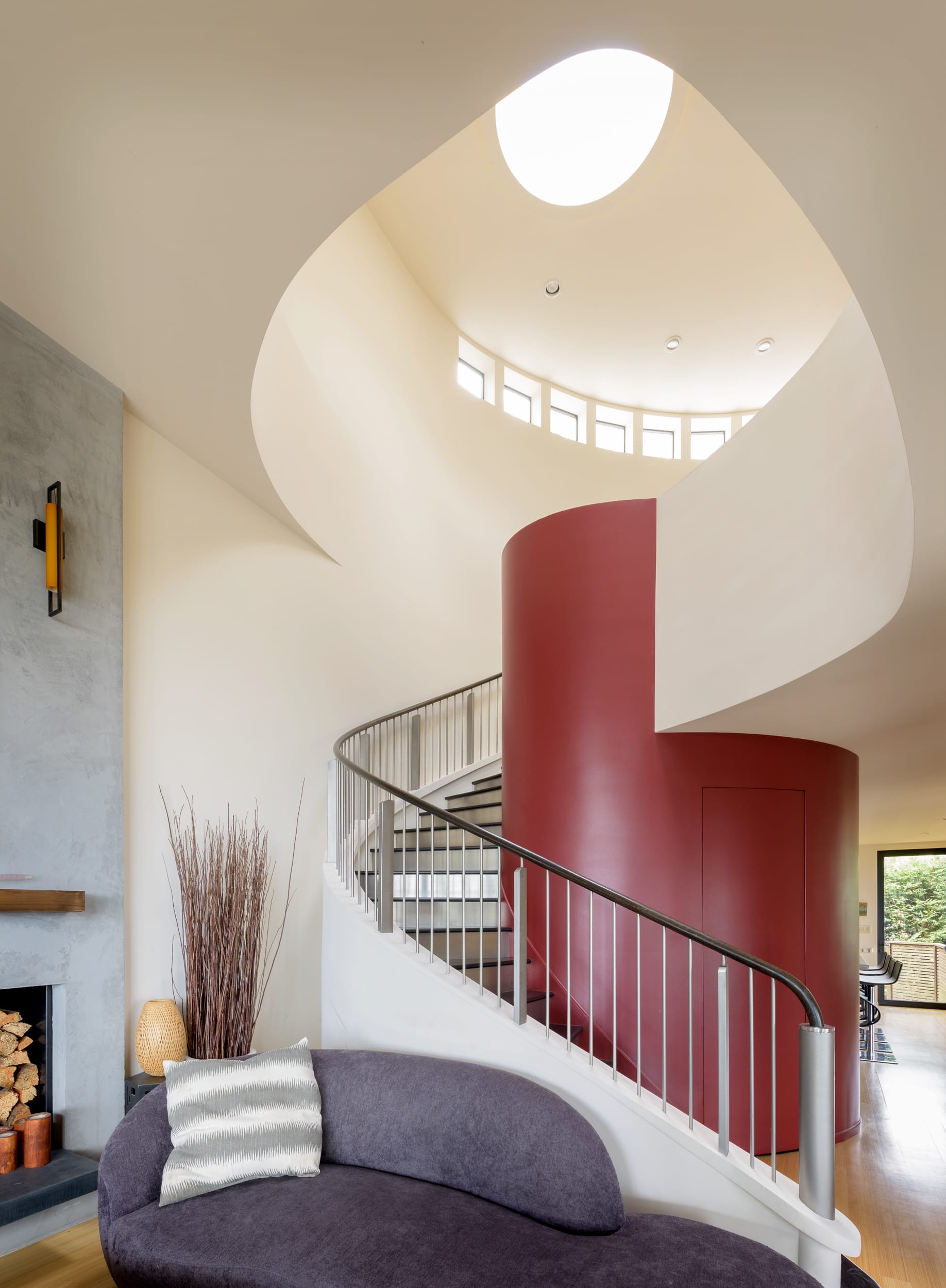 A spiral staircase in a living room.