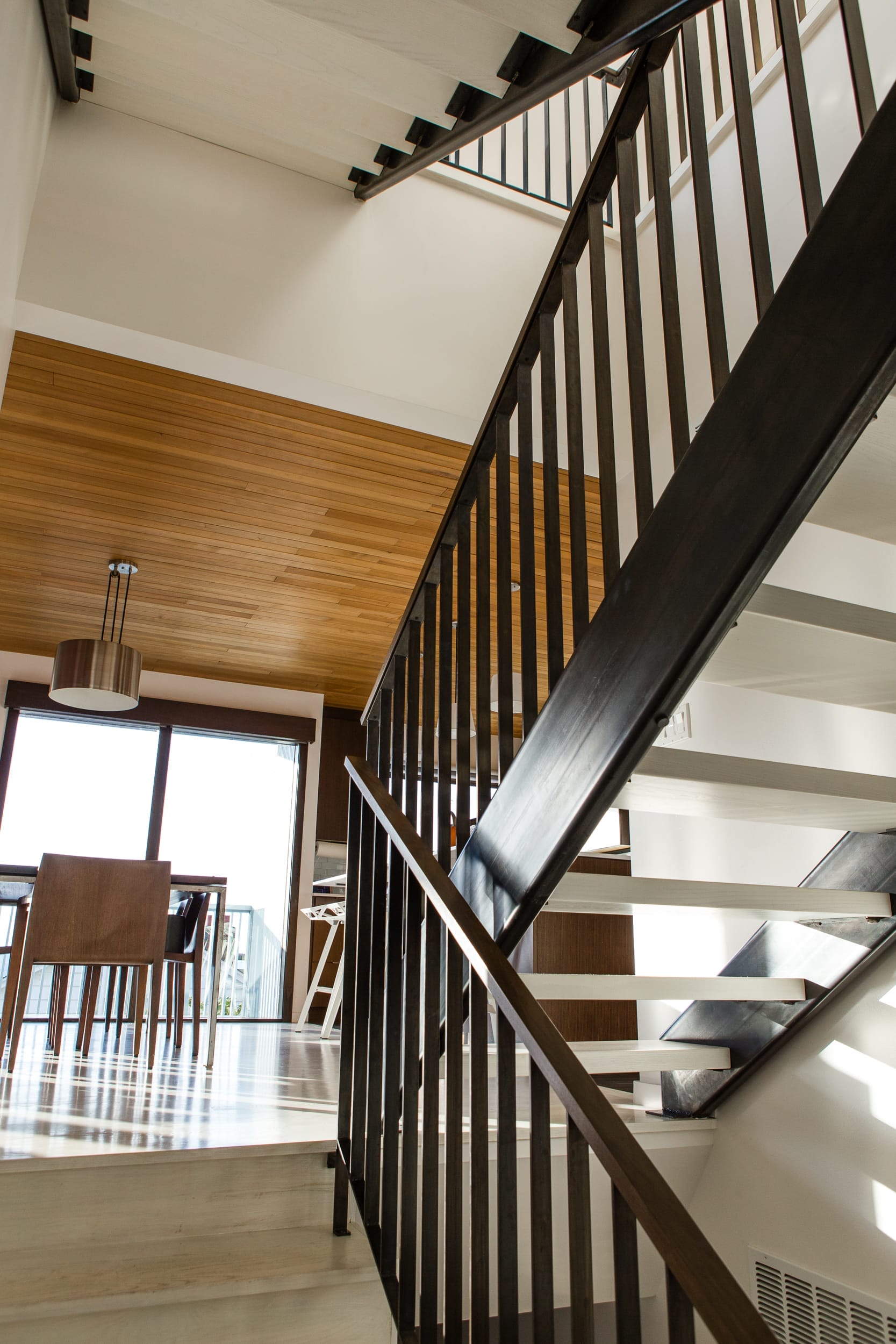 A modern home with a beautifully crafted staircase designed and built by a skilled carpenter.