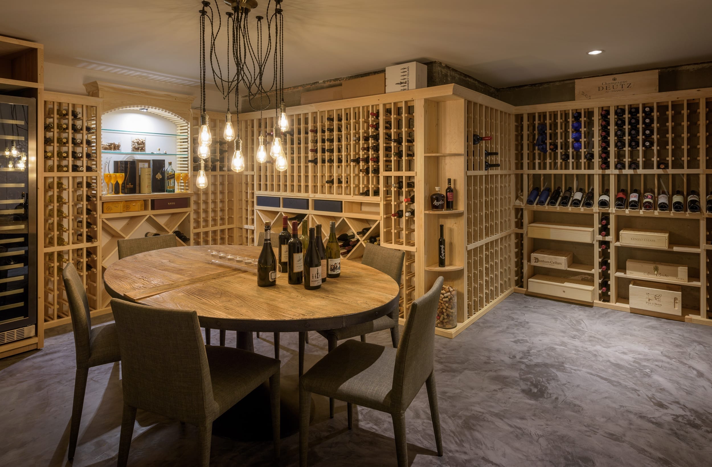 A wine cellar with a table and chairs.